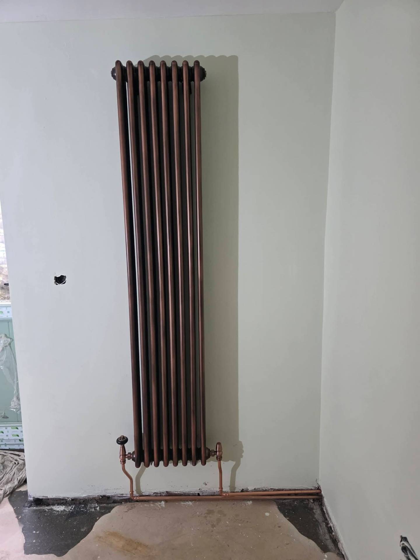 Traditional copper column radiator installed in a Greater Manchester period property